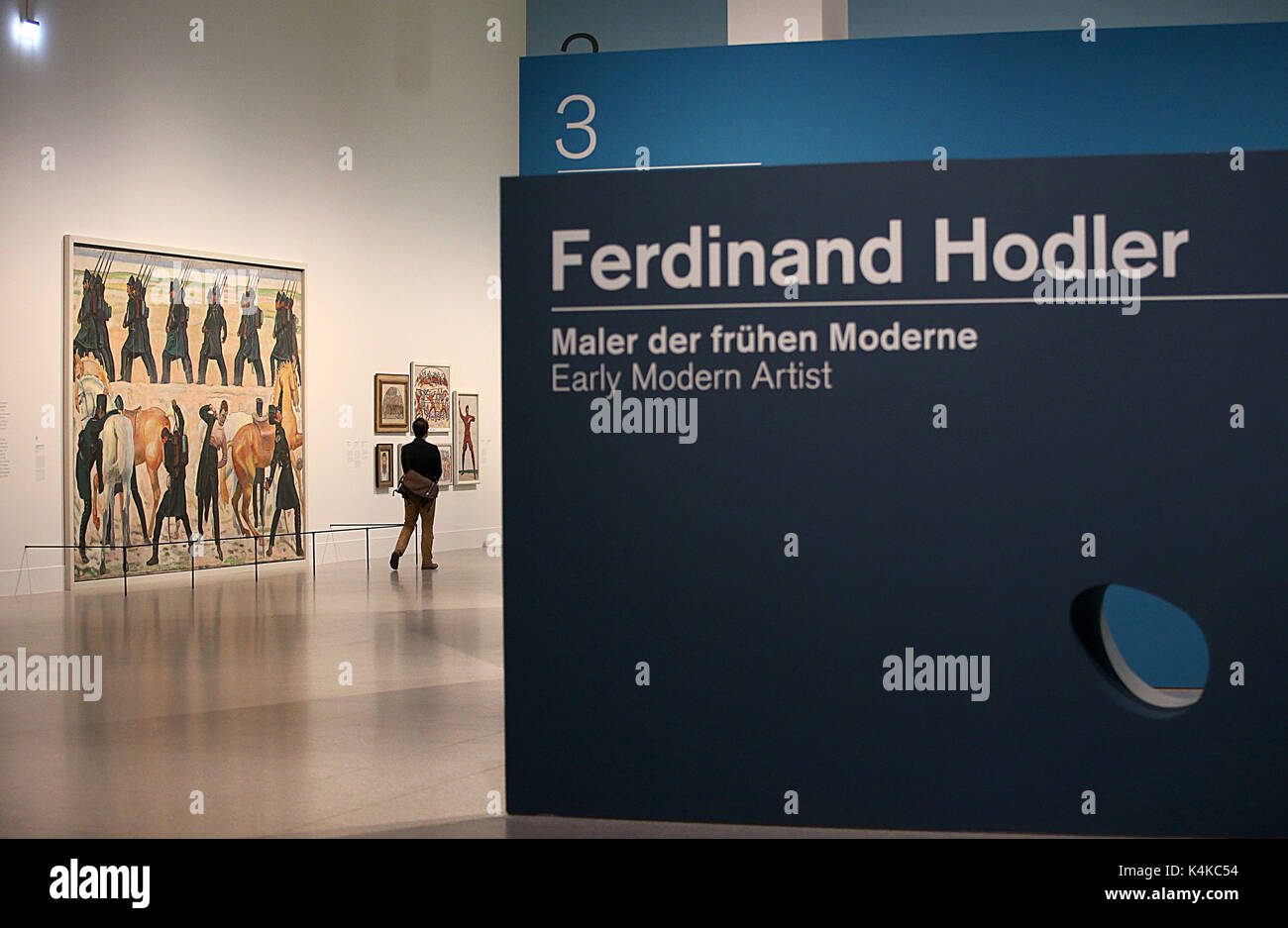 Bonn, Germany. 7th Sep, 2017. A woman walks past Ferdinand Holdler's painting 'Auszug der deutschen Studenten in den Freiheitskrieg 1813' ('German Students Move Out in the War of Liberation, 1813') in the Federal Art Hall in Bonn, Germany, 7 September 2017. The gallery is currently hosting a retrospective of Holdler's work entitled 'Ferdinand Holdler: Early Modernist Painter'. The show opens on the 8 September and runs through to the 28 January 2018. Photo: Oliver Berg/dpa/Alamy Live News Stock Photo