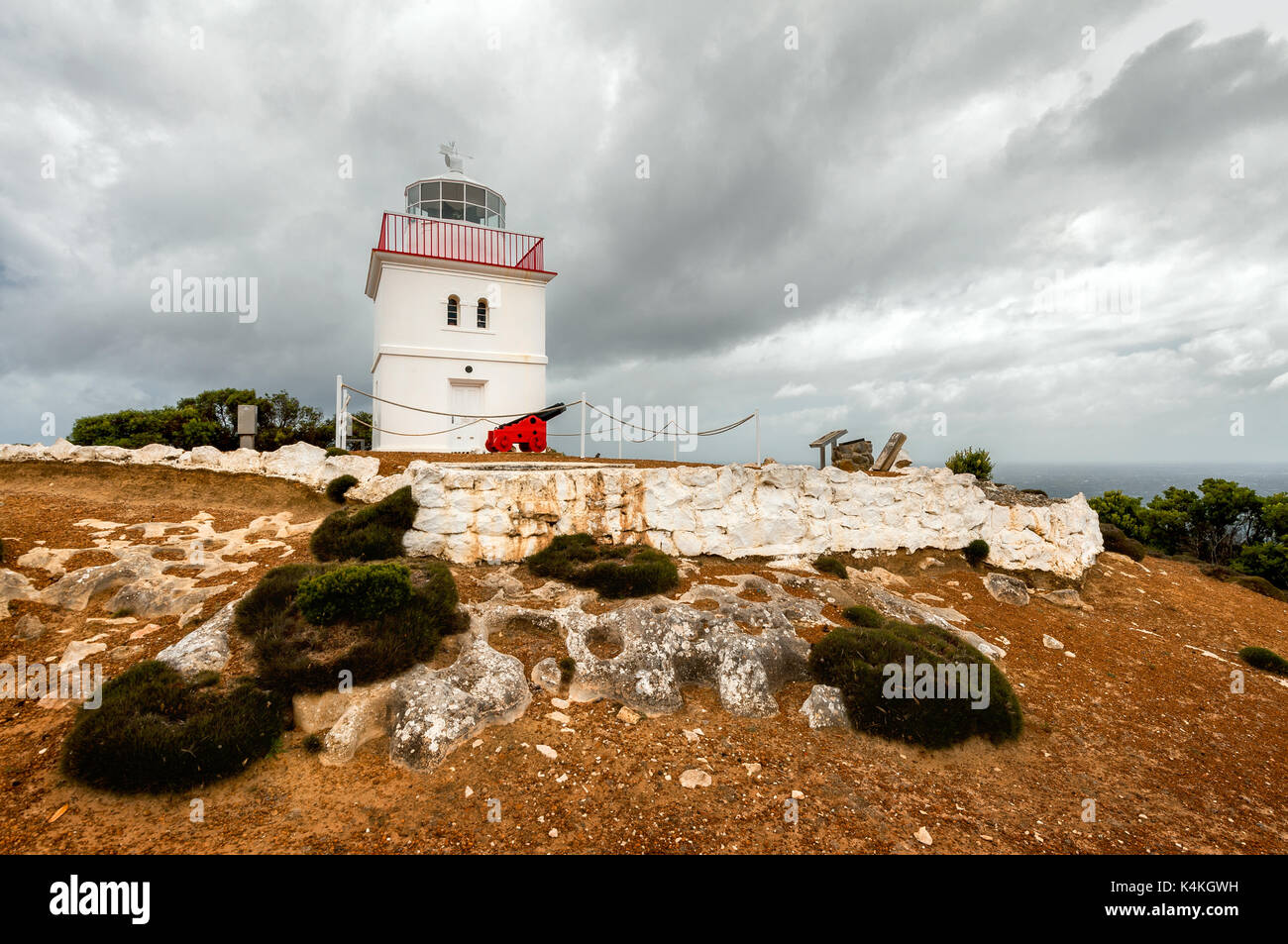 Cape Borda Lighthouse under dark clouds. Stock Photo