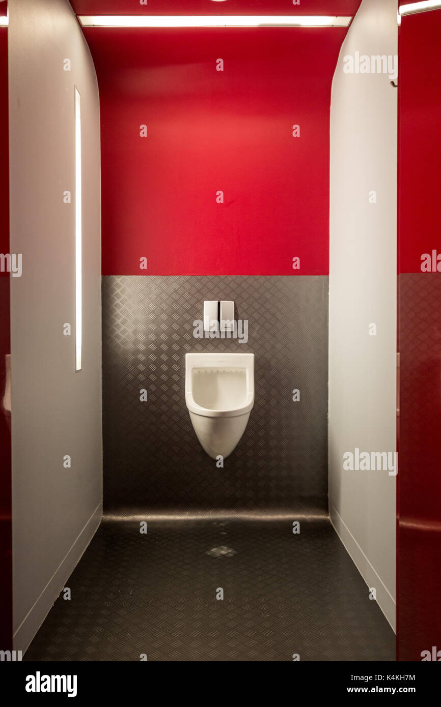 Urinal in modern public toilet nicely illuminated Stock Photo