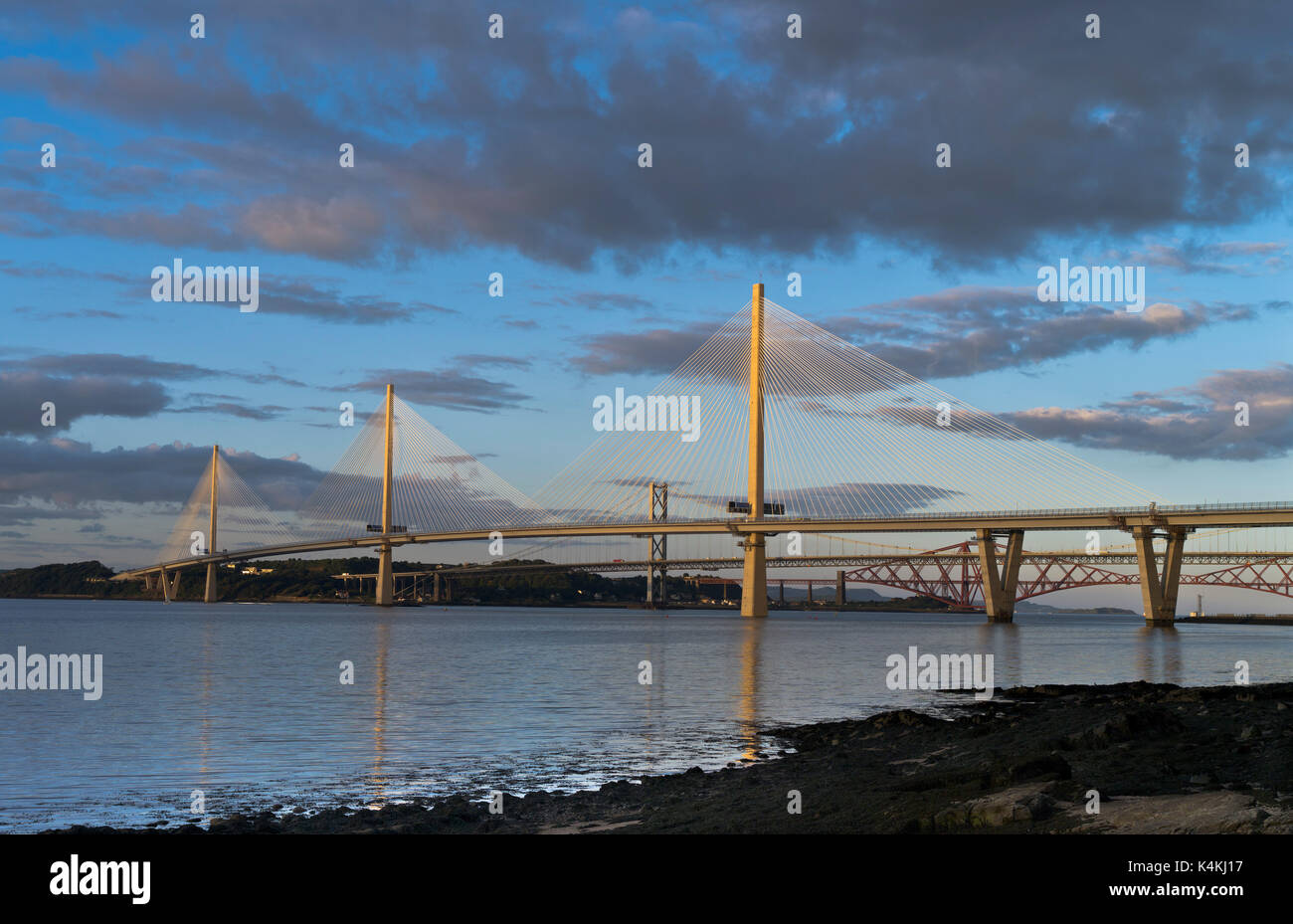 dh Queensferry Crossing FORTH BRIDGE LOTHIAN Three River Forth Bridges Queensferry crossing sunset stayed cable stay scotland Stock Photo
