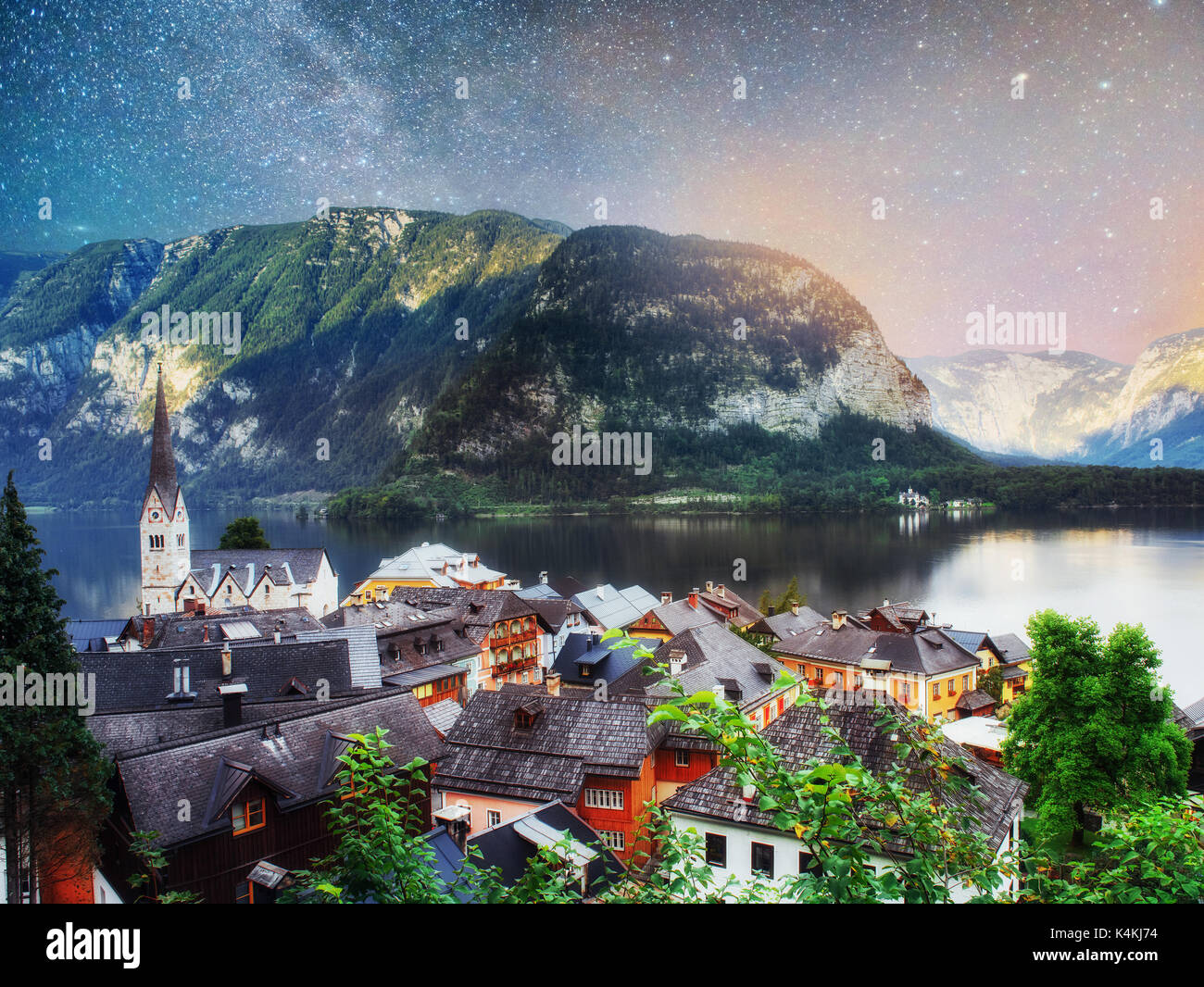 Scenic panoramic view of the famous mountain village in the Austrian Alps. Fantastic milky way. Hallstatt. Austria Stock Photo