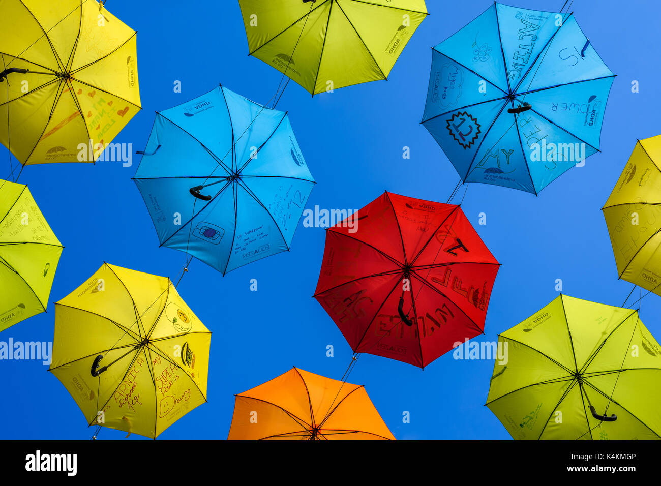 Colourful umbrellas hanging above a street in Liverpool city centre to