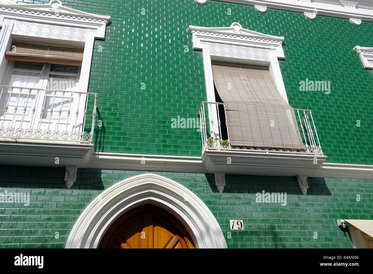 Detail of a green-tile wall in the centre of Ayamonte, Spain Stock Photo