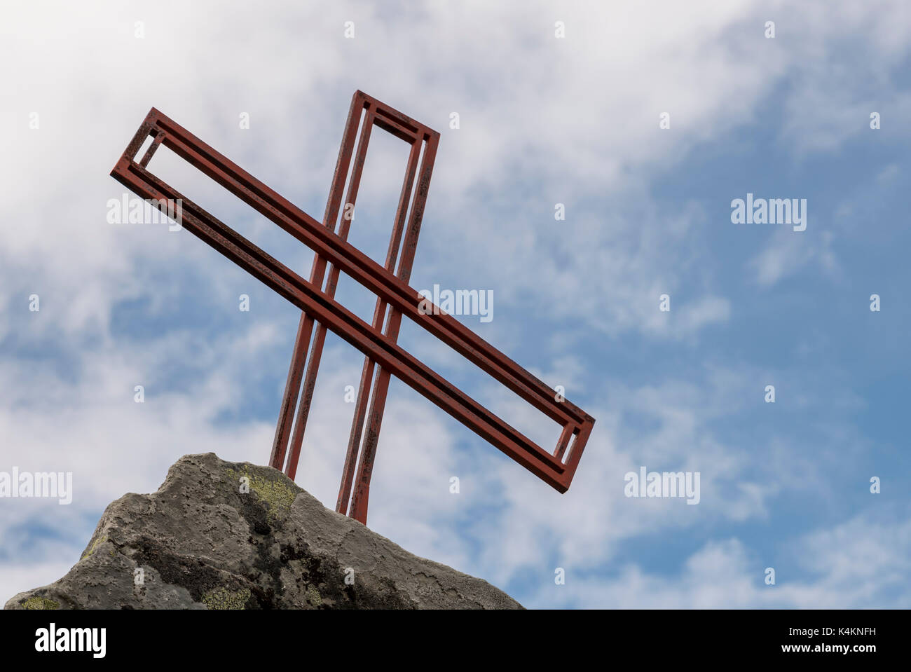 religion cross as monument on a rock in norway Stock Photo
