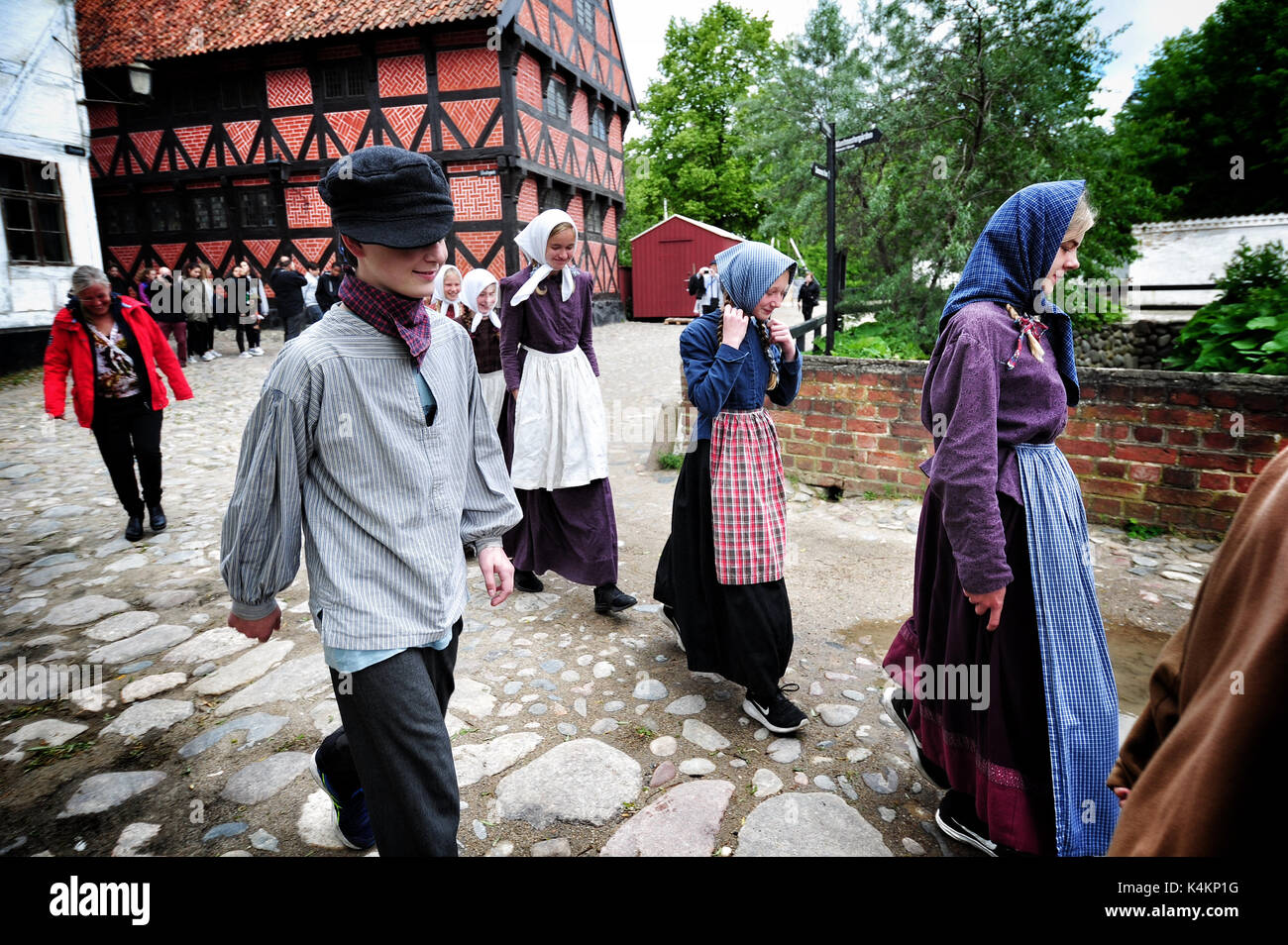 People in period costumes at Den Gamle By (The Old Town), an open-air folk museum known in Aarhus, Denmark. Stock Photo