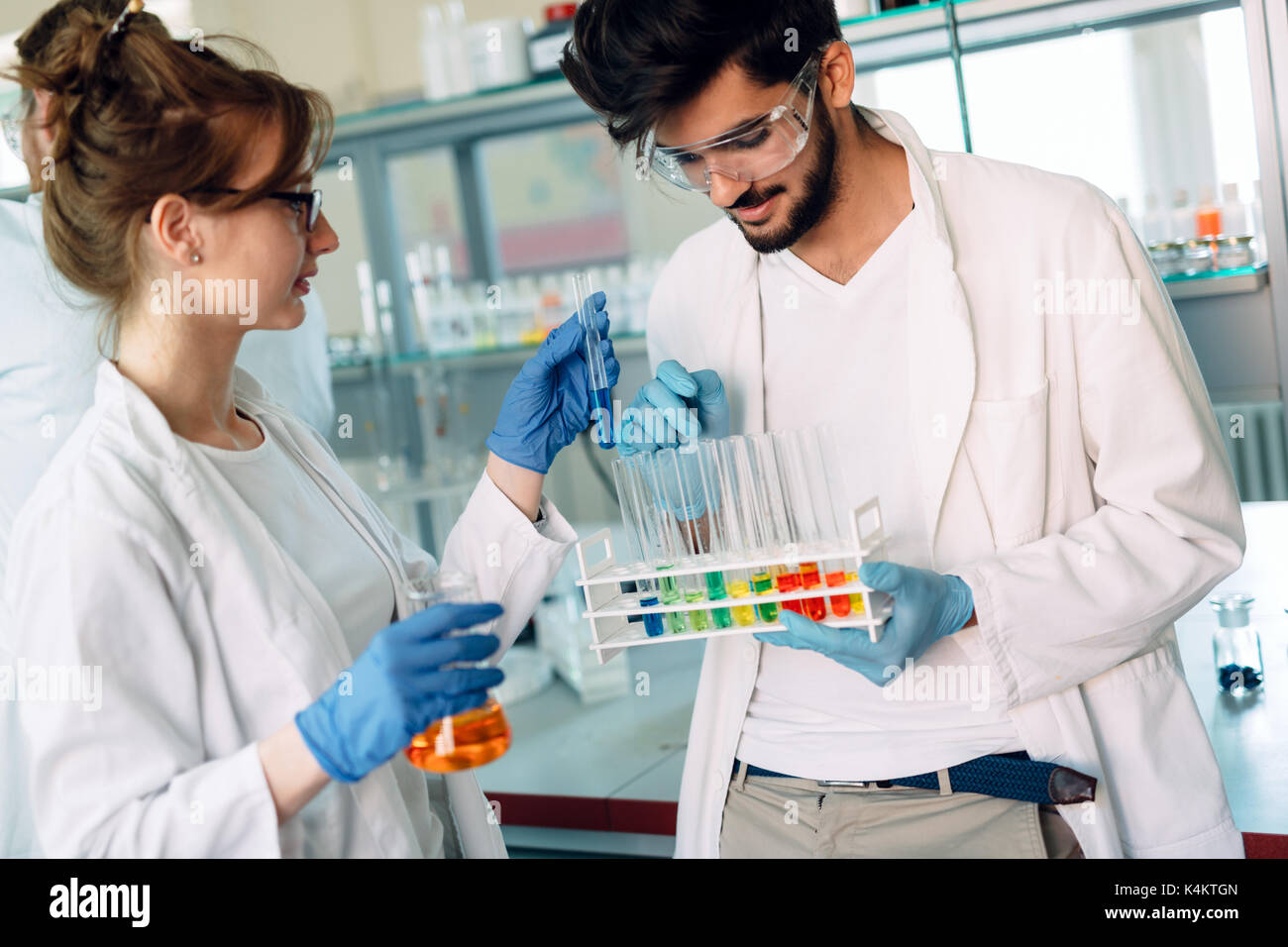 Young students of chemistry working in laboratory Stock Photo