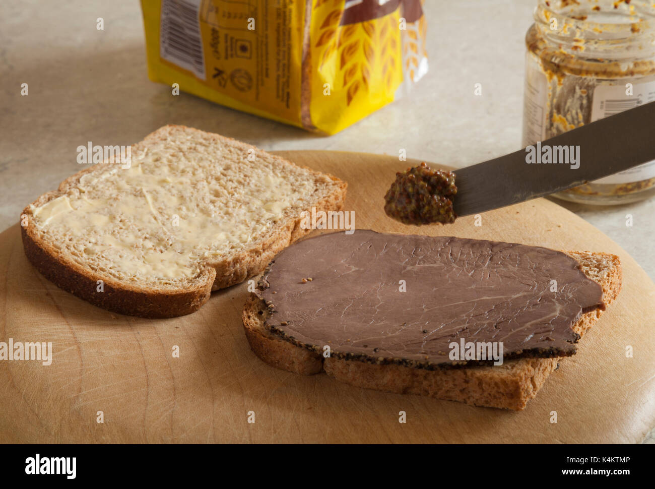 Making a sandwich using wholemeal bread, British beef with a peppered