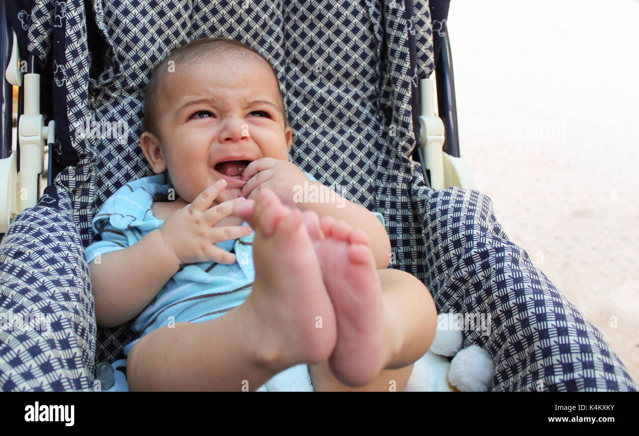 angry five months old teething baby boy Stock Photo Alamy