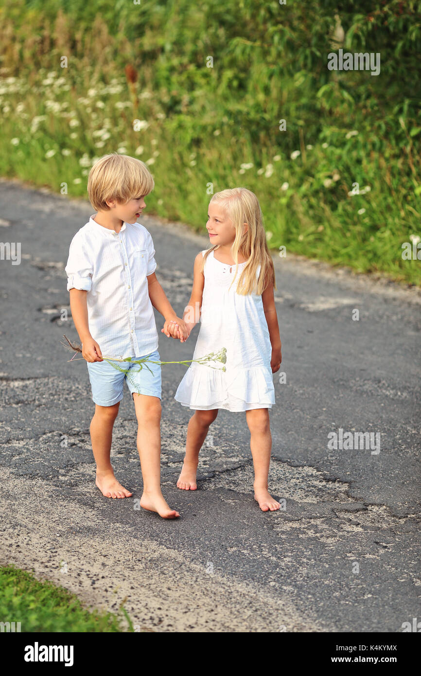 Children siblings hold hands hi-res stock photography and images - Alamy