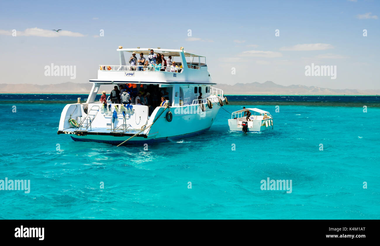 Hurghada, Egypt - August 15, 2015: Here comes a lot of tourists on yachts and boats to swim, sunbathe, go diving and have a good time Stock Photo