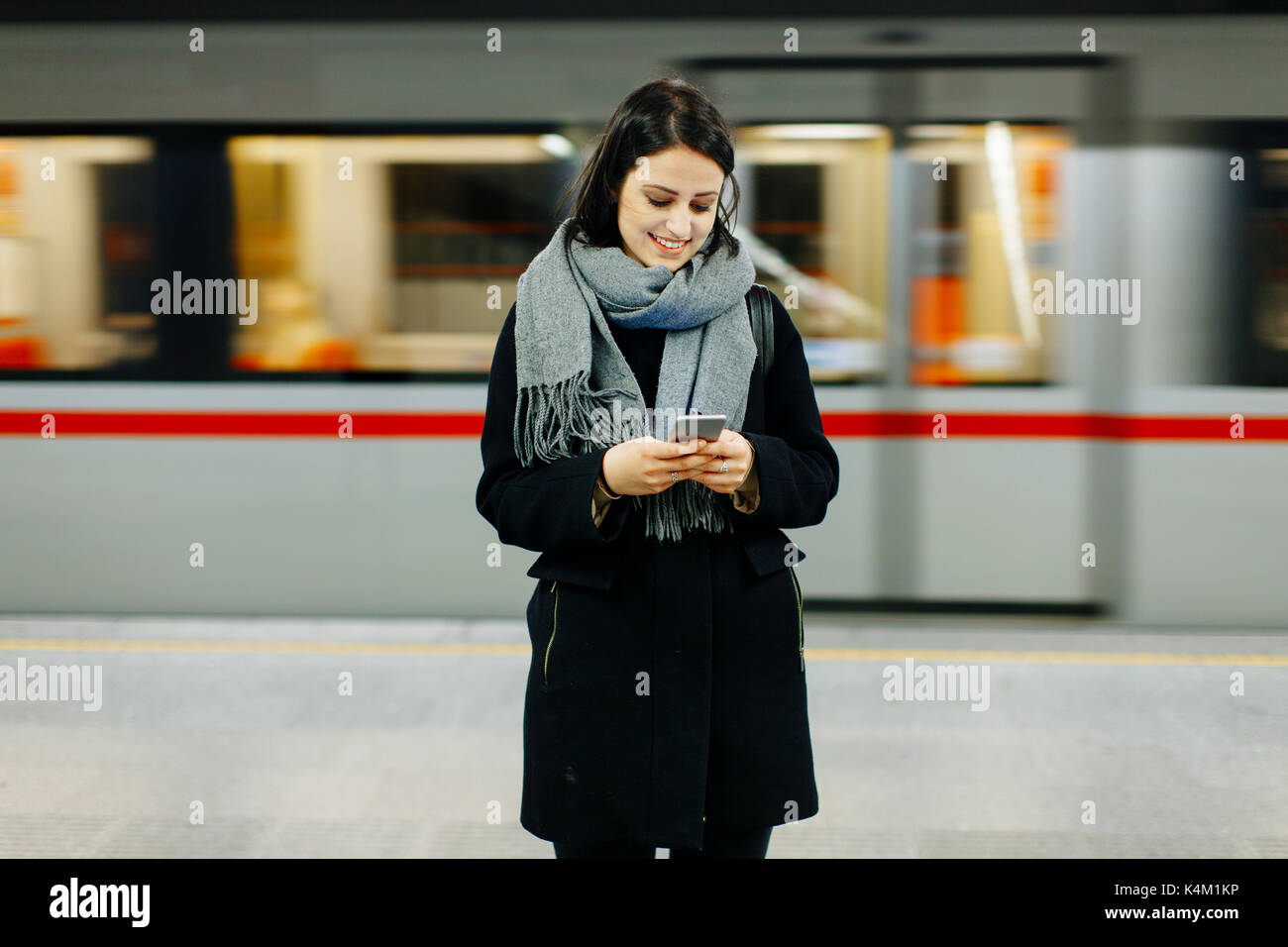 Woman waiting train hi-res stock photography and images - Alamy
