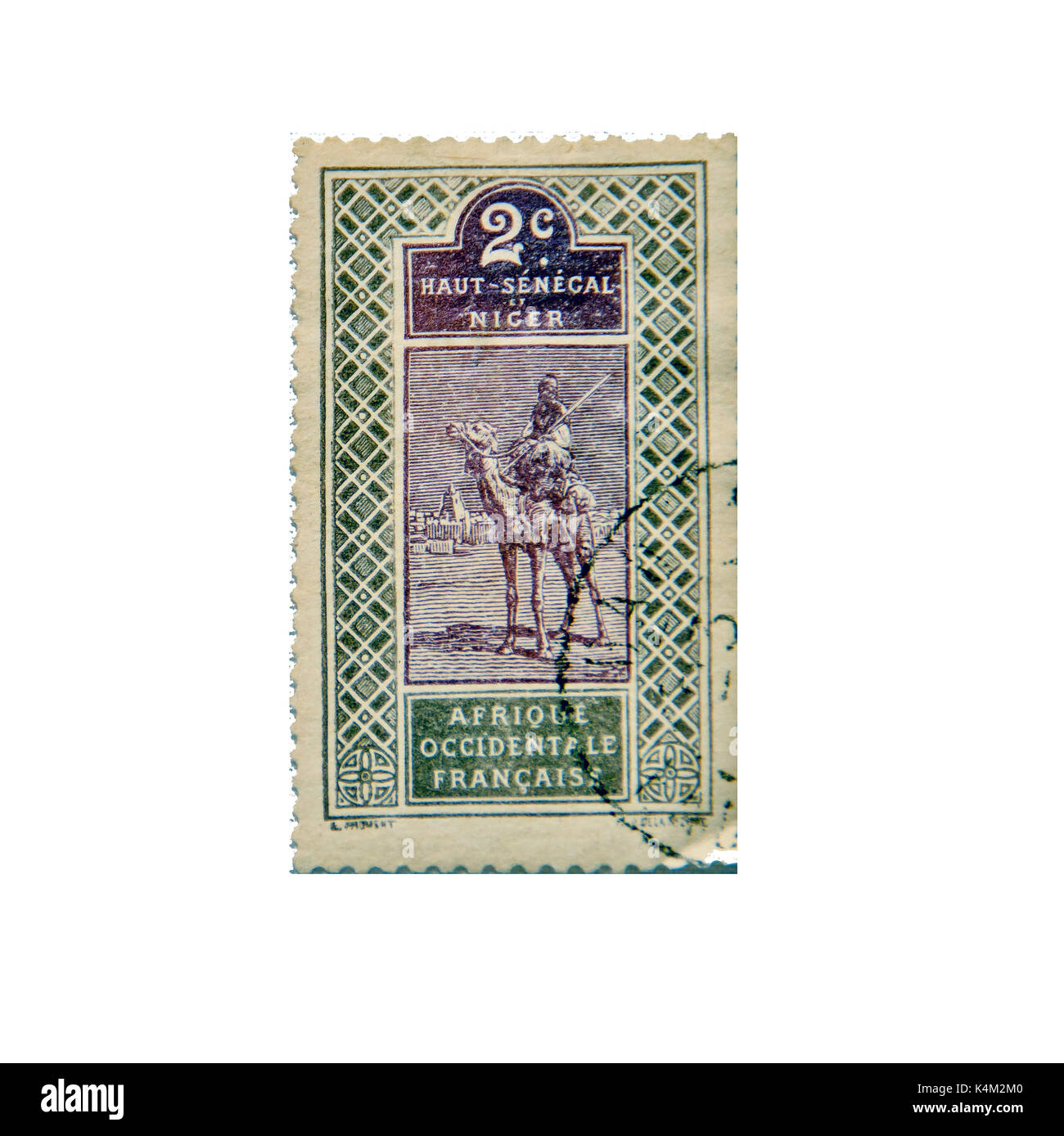 NIGER - CA. 1915: Postage stamp ca. 1915 from Niger and Upper Senegal showing a traditional scene of a man on a camel Stock Photo