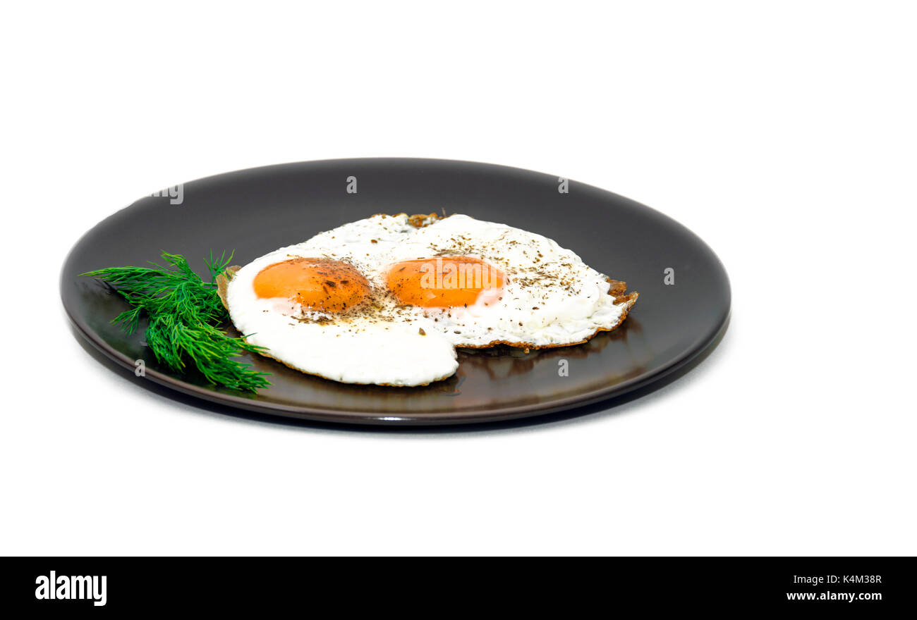 Fried eggs on the plate Stock Photo