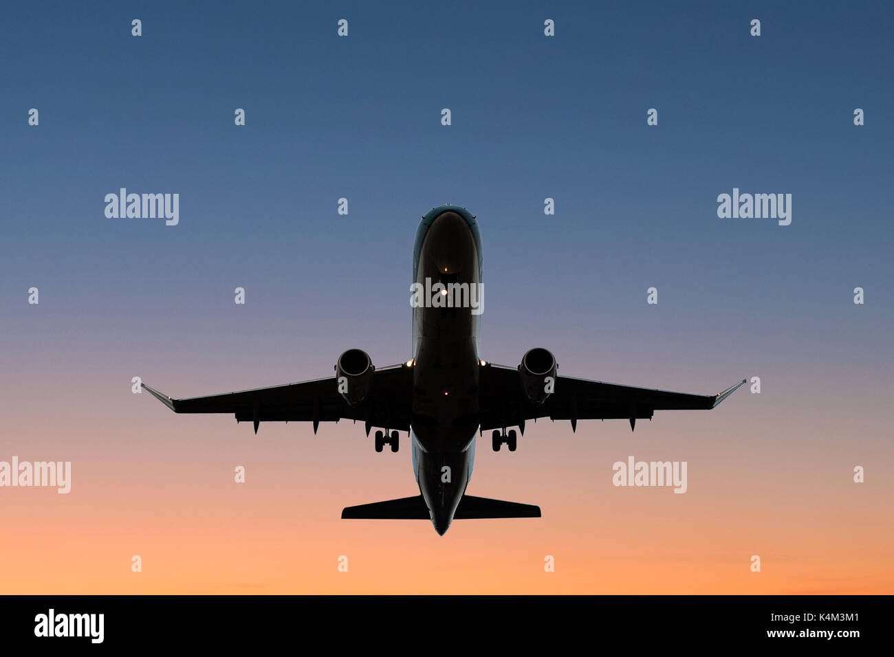 airplane on sunset sky - aircraft silhouette scenic sky Stock Photo