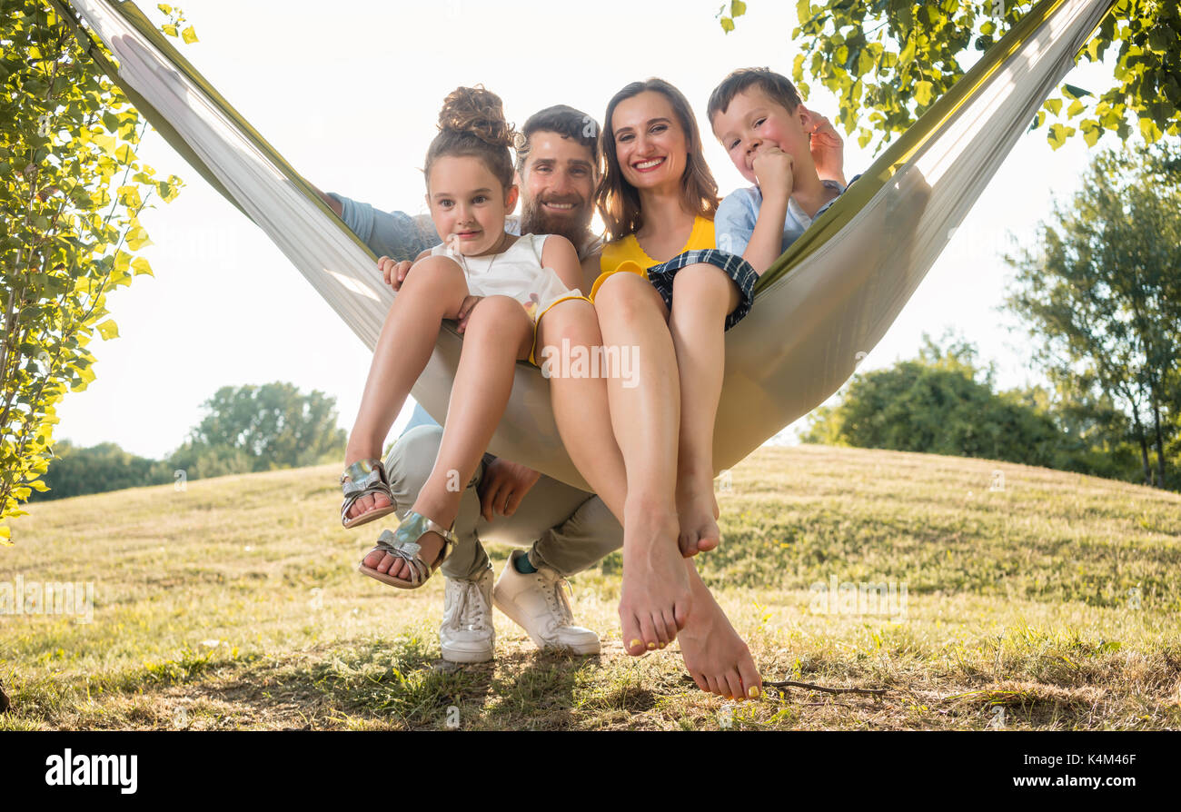 Family portrait with beautiful mother of two children next to he Stock Photo