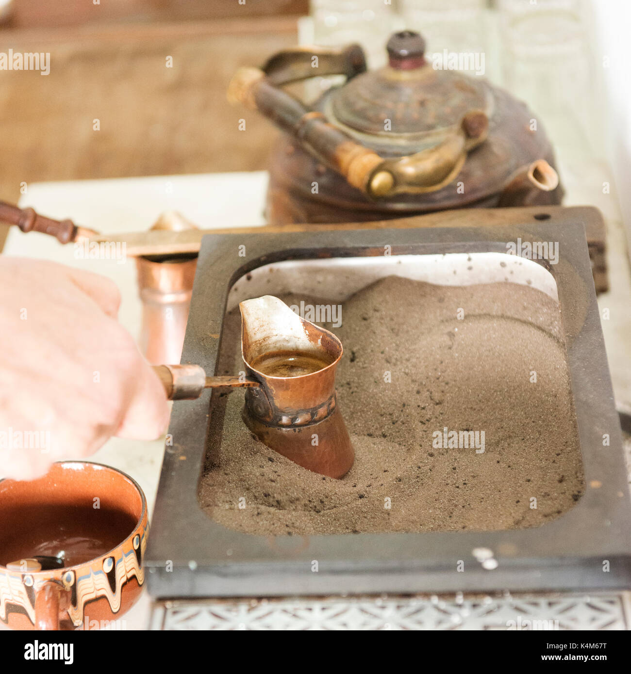 Traditional coffee being made in hot sand in Veliko Tarnovo's old town