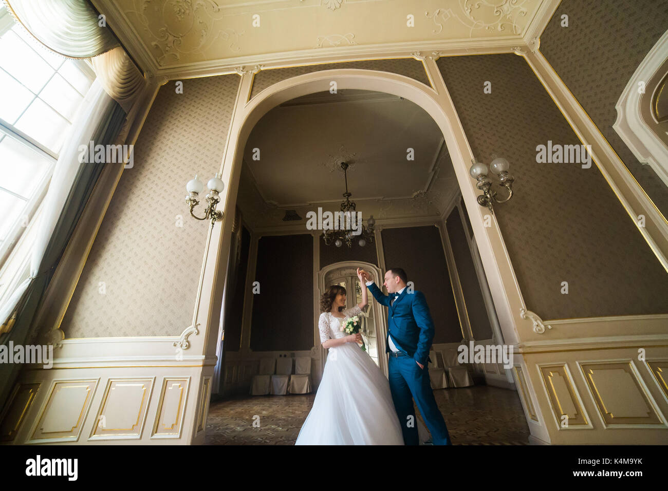 Beautiful newlyweds in palace hi-res stock photography and images - Alamy