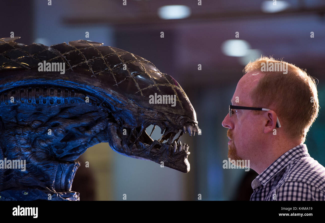 Paul Wallis views a Alien creature mask from the movie 'Alien Vs Predator', which is expected to fetch &pound;4,000 - &pound;6,000, during a preview of Prop Store Live Entertainment Memorabilia Auction, at BFI IMAX in London. Stock Photo