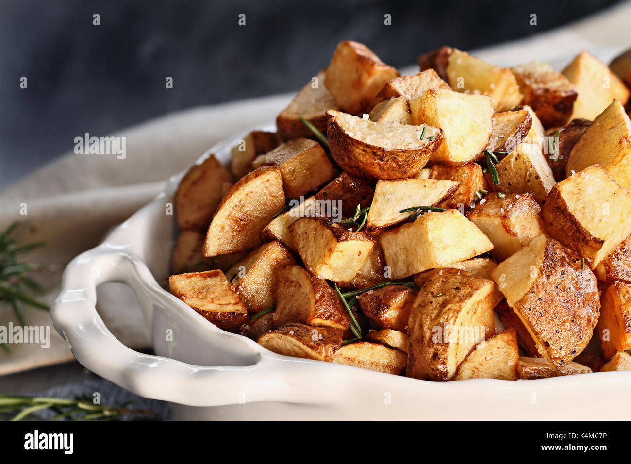 Roasted potatoes quartered and seasoned with rosemary and sea salt