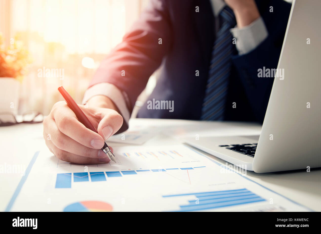 Professional manager working with finance document. Accountant signing finance report. Analysis working budget accounting startup economy man concept Stock Photo