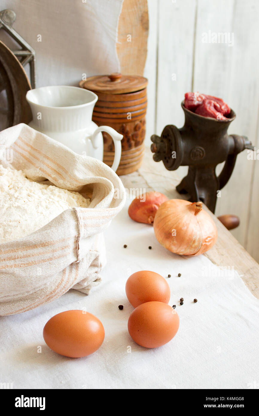 Ingredients for dumplings or pelmeni, rustic style, selective focus. Stock Photo