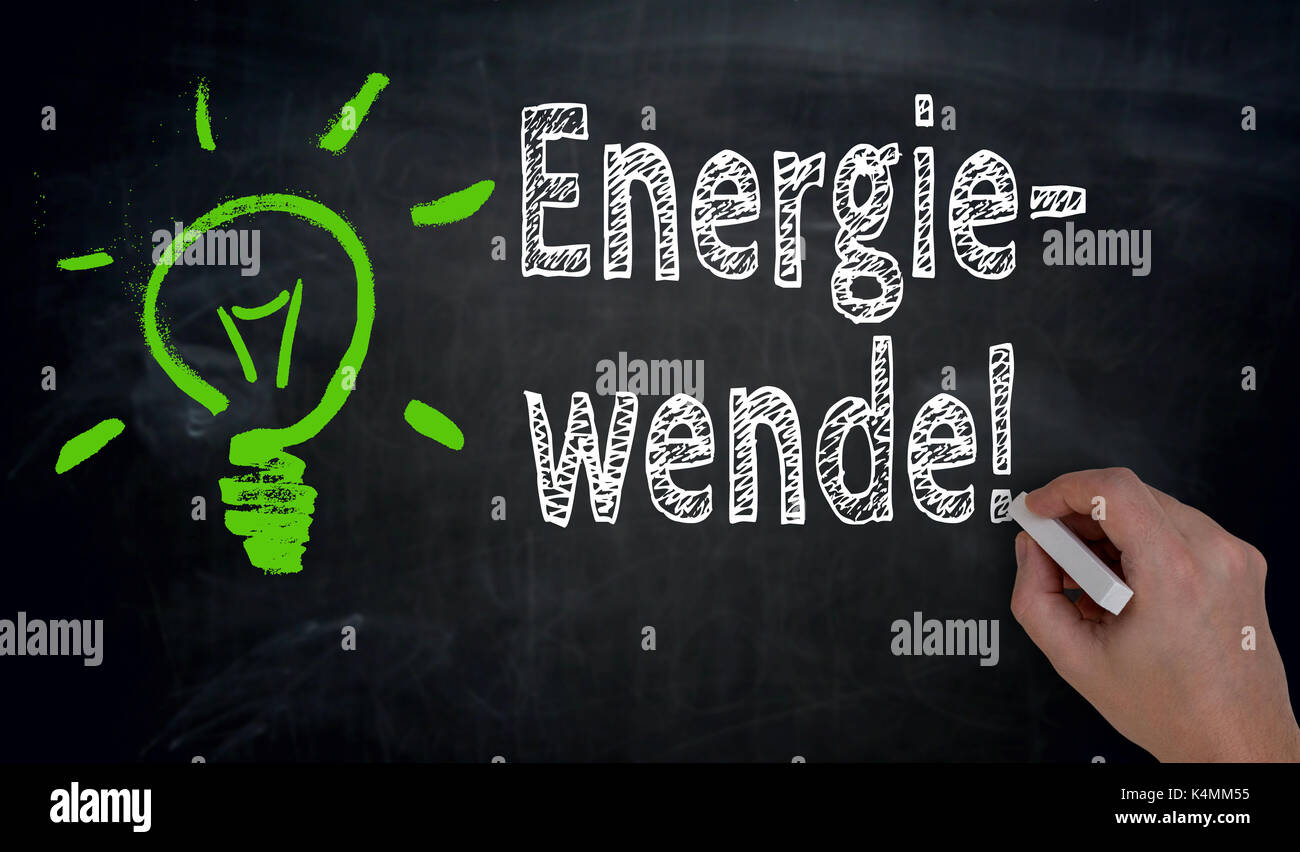 Energiewende (in german green Energy) is written by hand on blackboard. Stock Photo