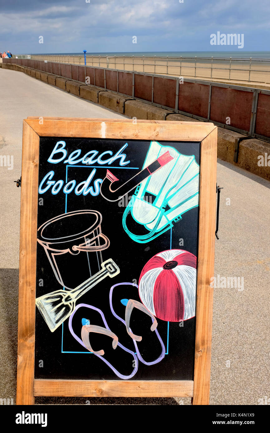 Sutton-on-Sea, Lincolnshire, UK. August 19, 2017. A artistic sandwich chalkboard advertising beach goods on sale at a promenade shop on the seafront a Stock Photo