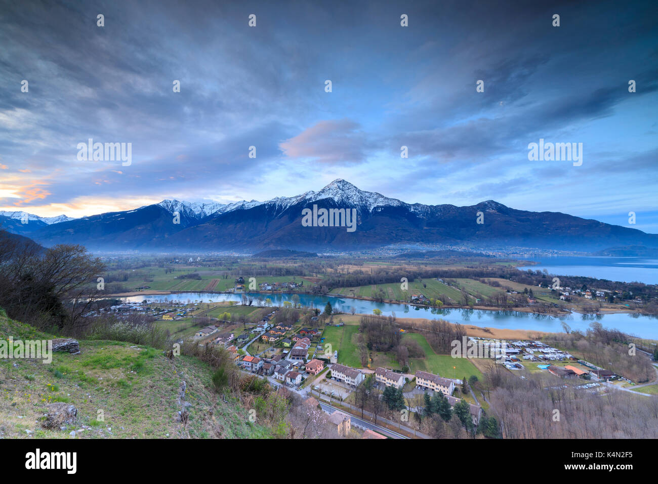 View of Sorico at dawn framed by Lake Como and snowy peaks seen from Chiesa Di San Miro, Province of Como, Lombardy, Italy, Europe Stock Photo