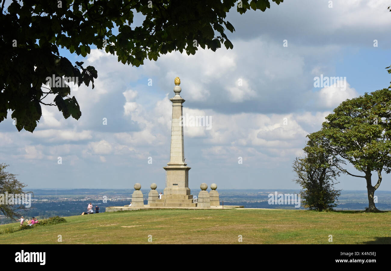 Chiltern Hills -top of Coombe Hill - South African war memorial - framed by trees - sunlight - cloud flecked sky - walkers picnic - view  Aylesbury Stock Photo