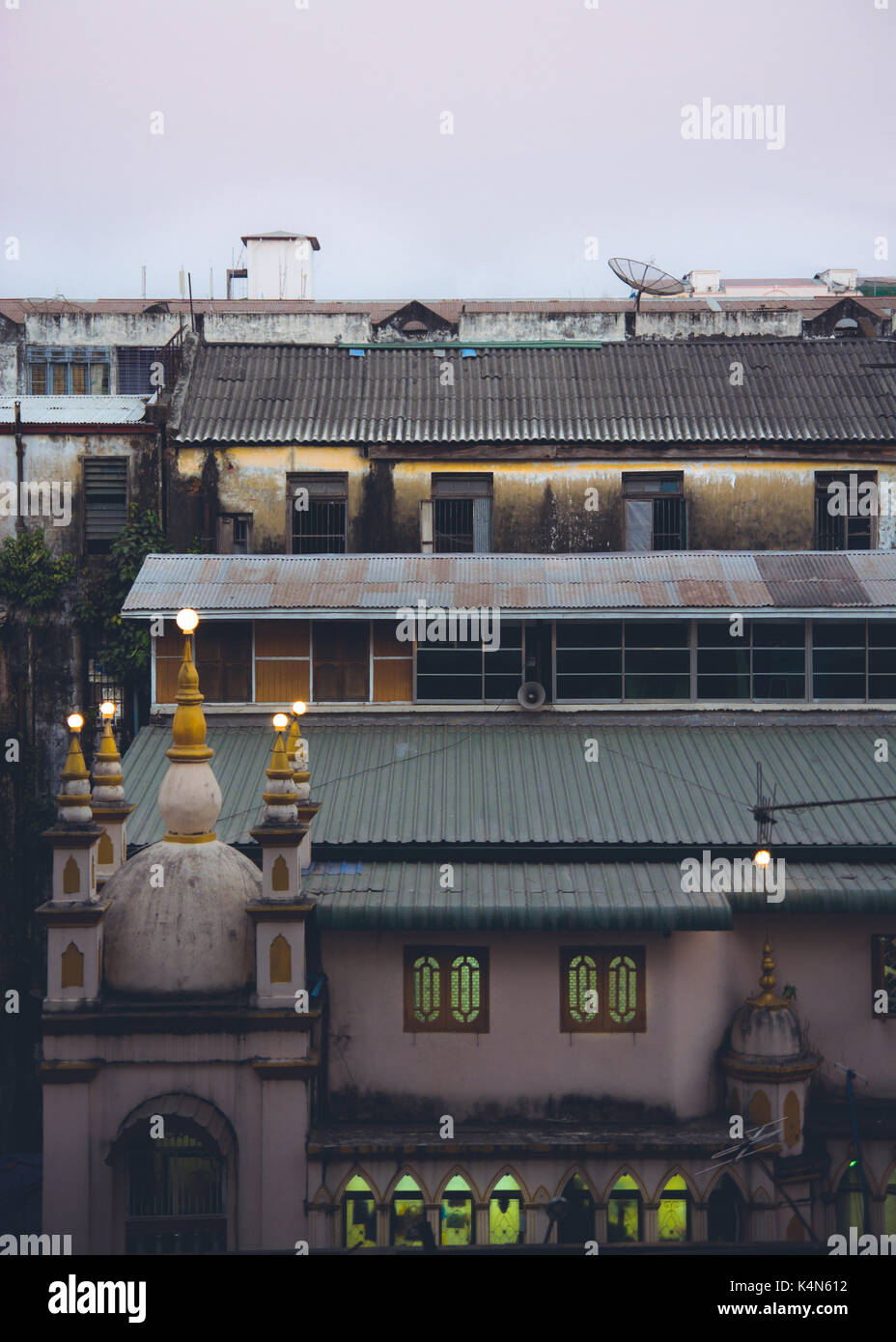 A Muslim mosque lights up as the call to prayer happens in Yangon, Myanmar, Burma. March, 2014. Stock Photo