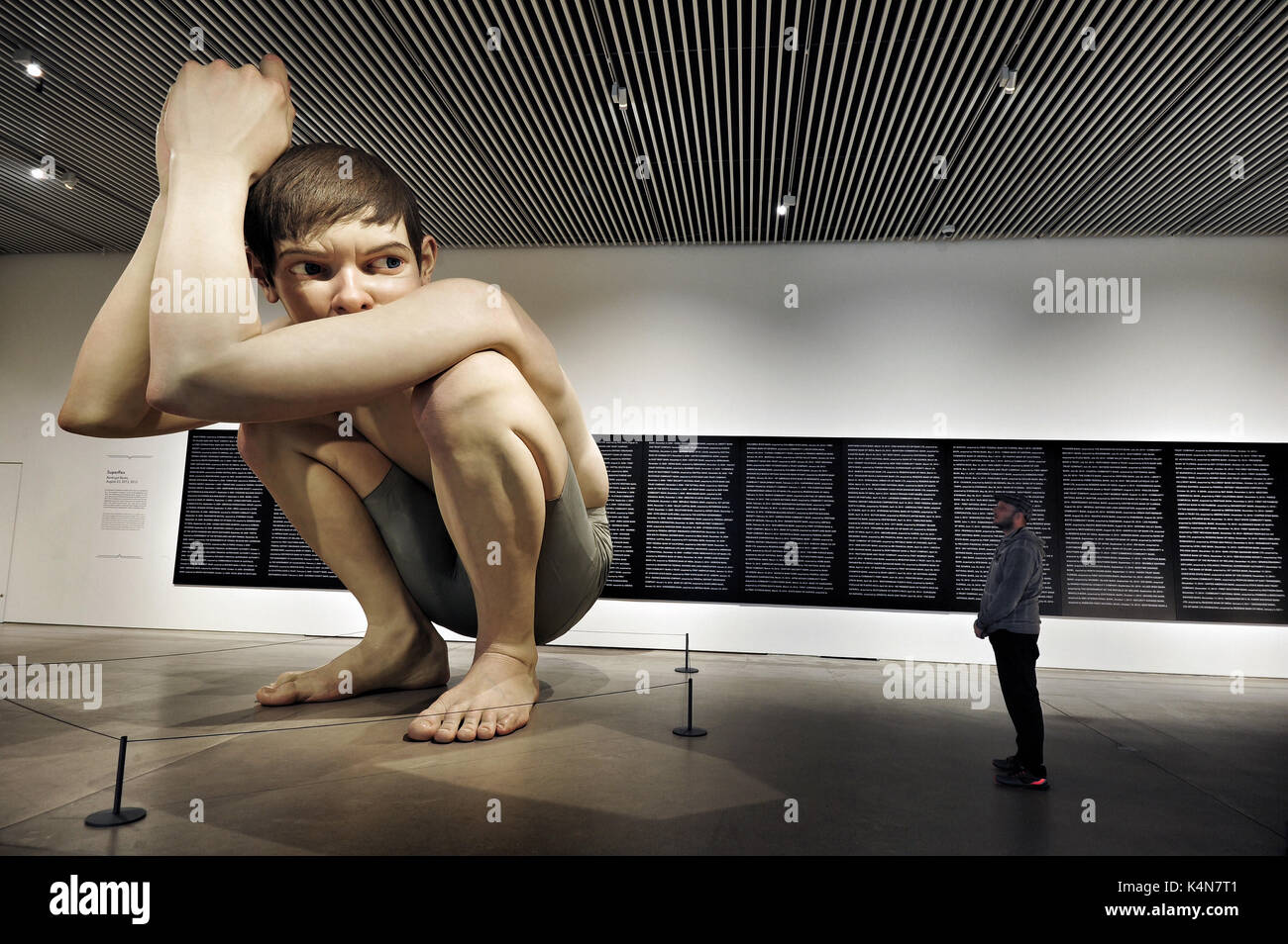 Ron Mueck's Boy at The ARoS Aarhus Kunstmuseum in Aarhus, Denmark. The Australian artist’s (b. 1958) sculpture has become one of the landmarks of the  Stock Photo