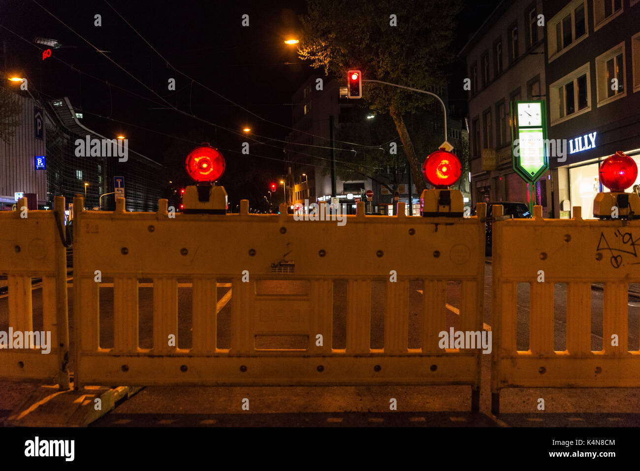 Dusseldorf, Germany April 16, Fence with red warning lights of a street under construction in Dusseldorf, Germany Stock Photo - Alamy