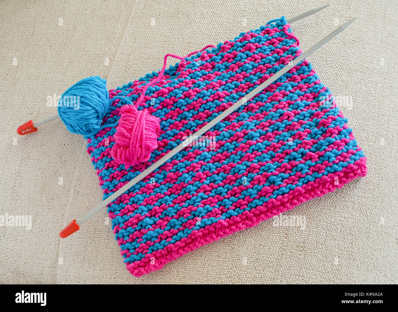 Homemade cotton dishcloths with knitting needles Stock Photo Alamy