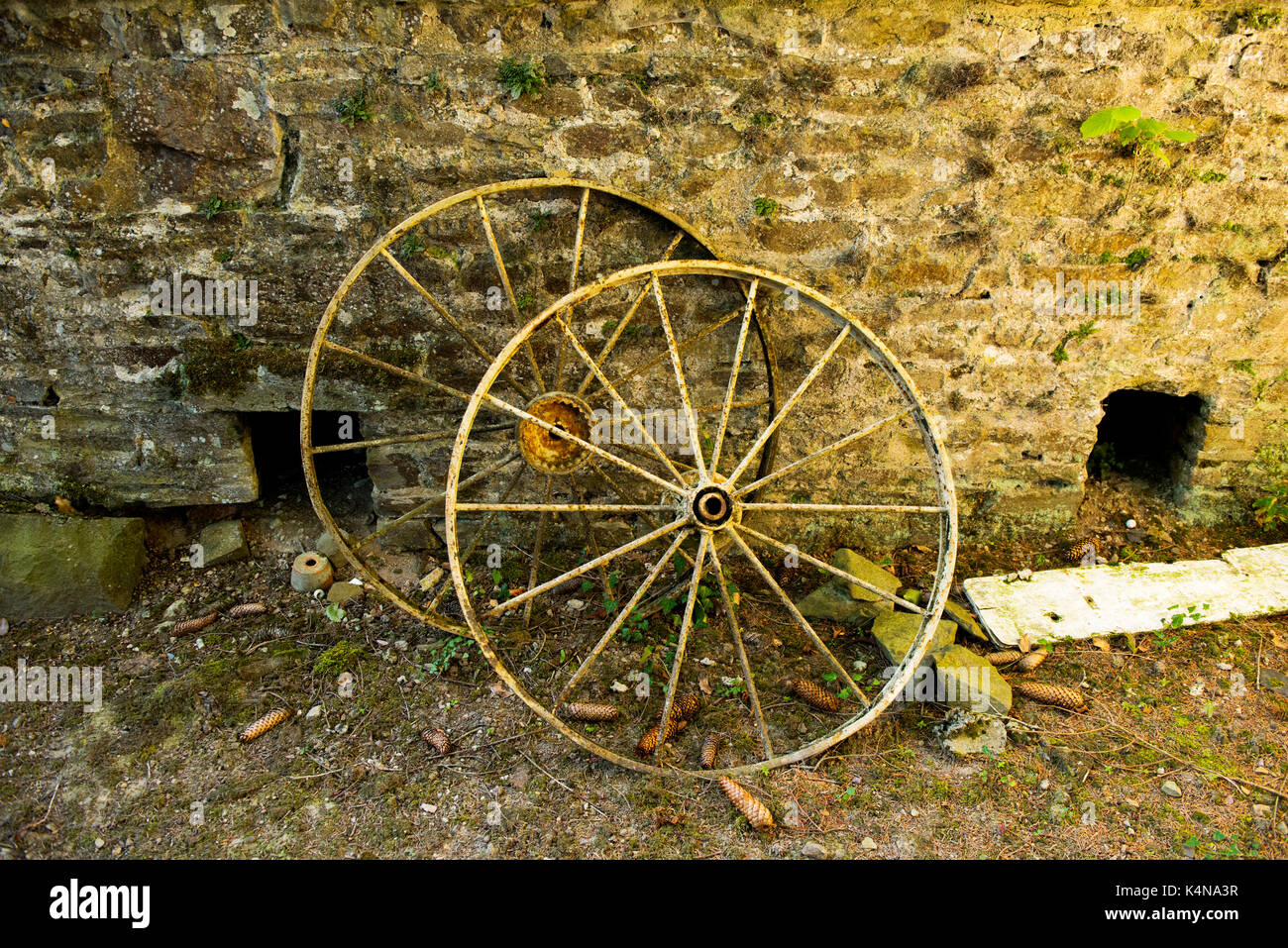 Wheels in Farmyard, Normandy France. Aug 2017 Stock Photo