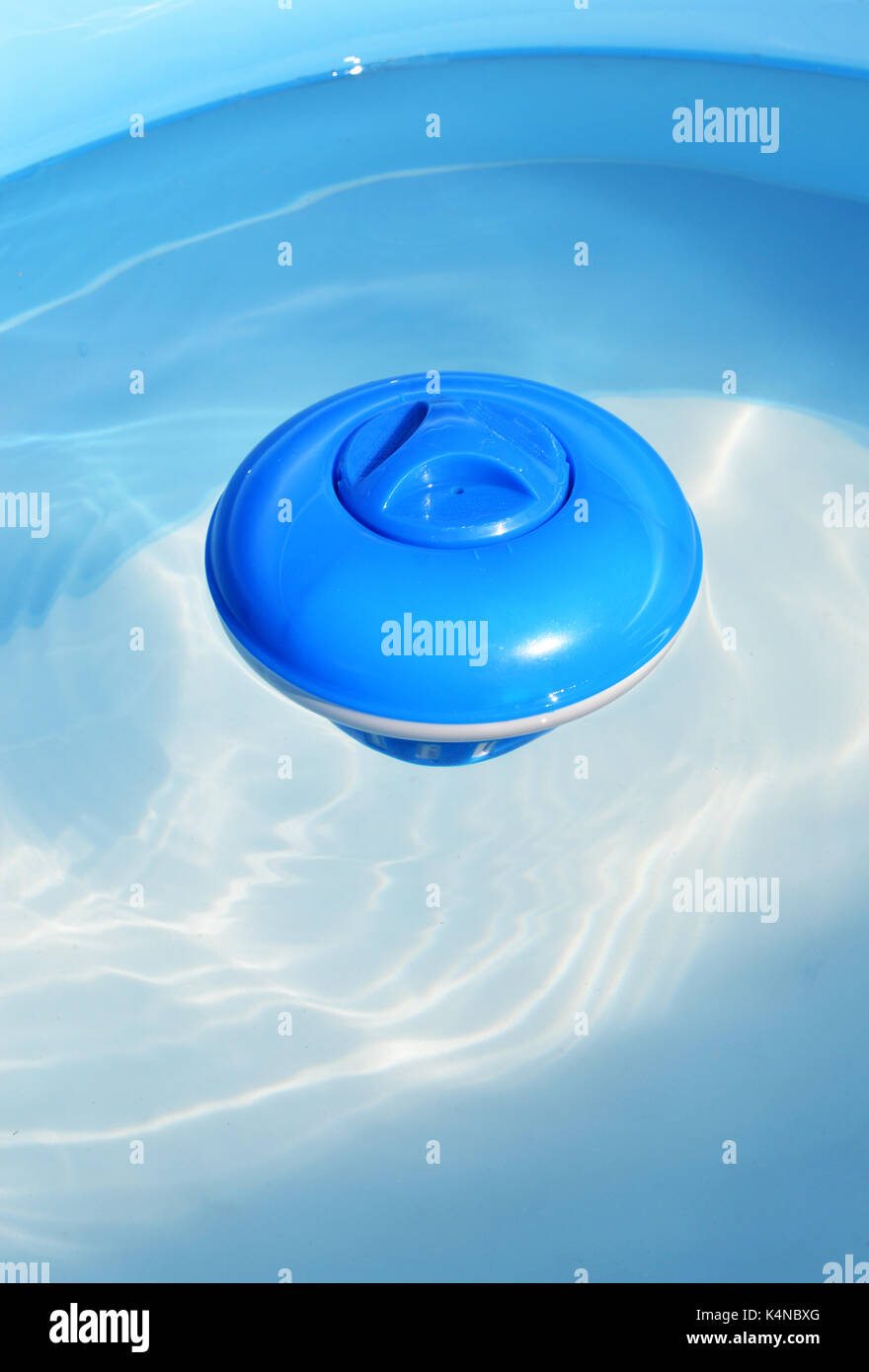 Floating chlorine diffuser for spa and swimming pool. For a water sanitation. Stock Photo