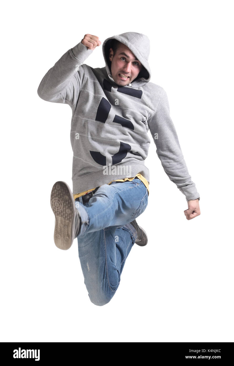 Funny cheerful happy man jumping in air over white background Stock Photo -  Alamy