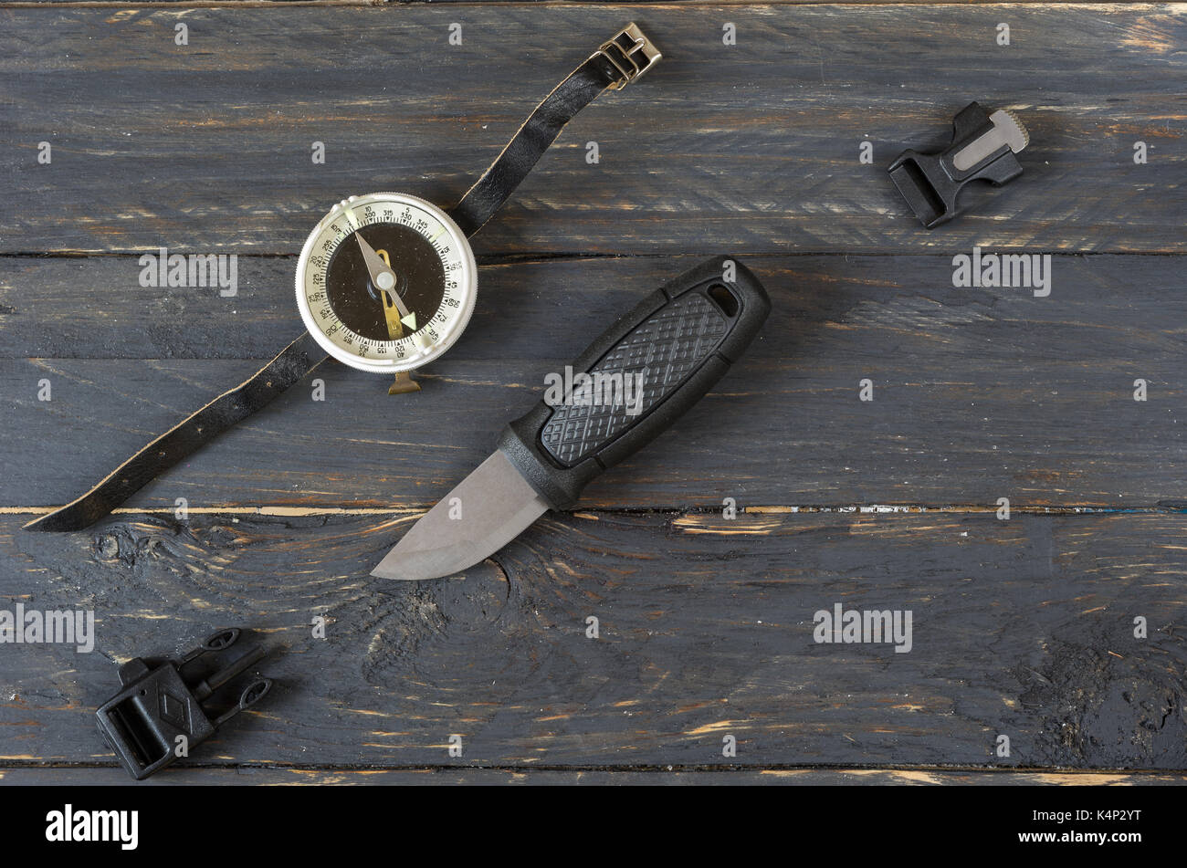 Knife, a compass and a flint for breaking fire Stock Photo Alamy