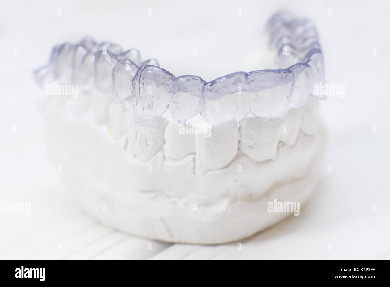 Closeup individual tooth tray Orthodontic dental theme. Invisible braces Stock Photo Alamy
