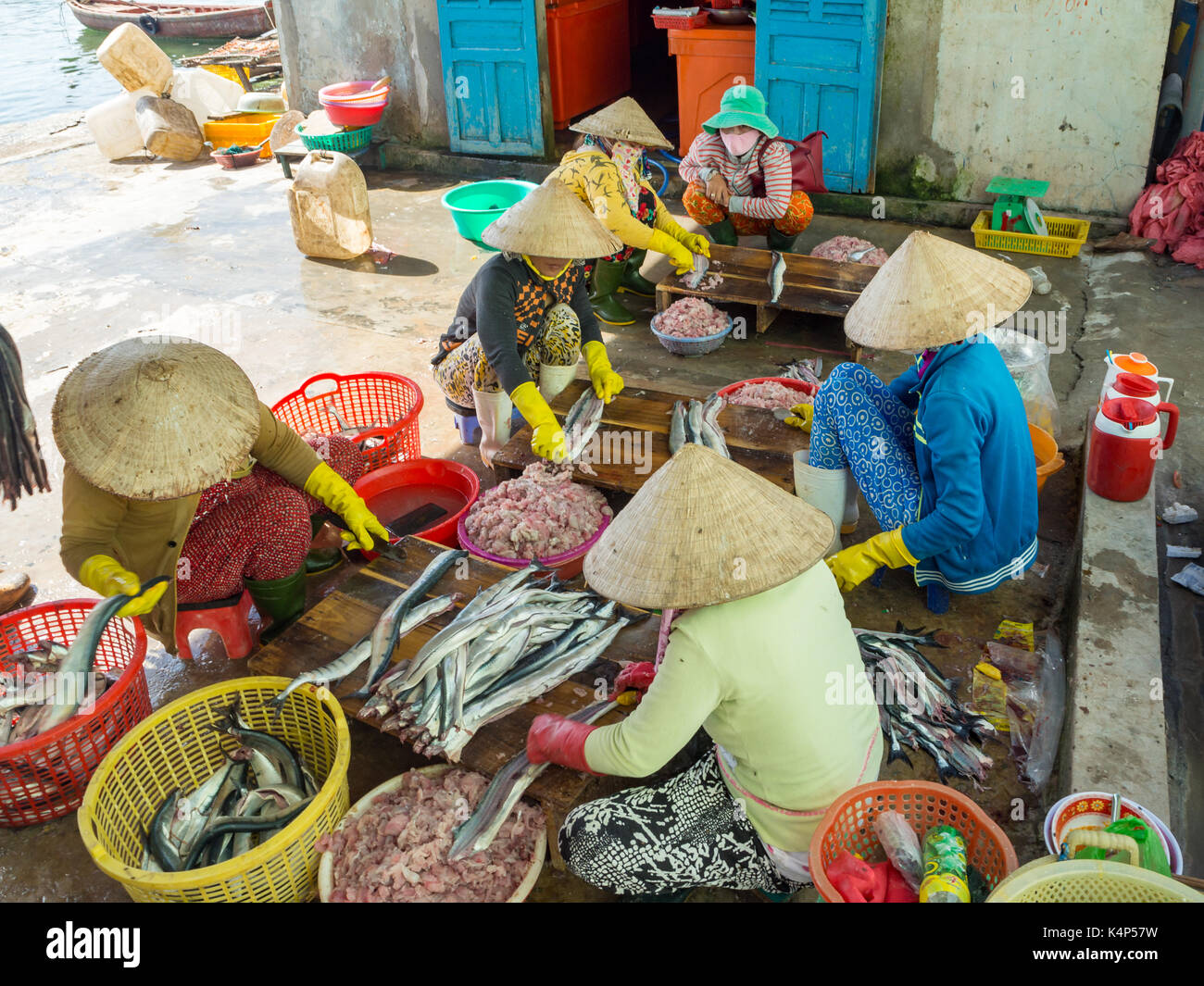 Vietnamese women processing fish meat in a fisher village at the Phu Quoc island, South Vietnam