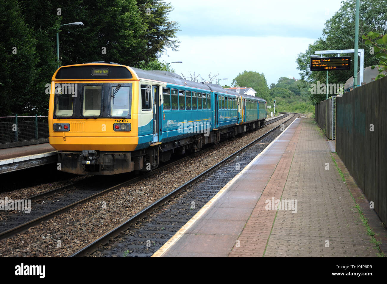 142077 (nearest camera) and 143625 at Eastbrook station with a service for Merthyr Tydfil. Stock Photo