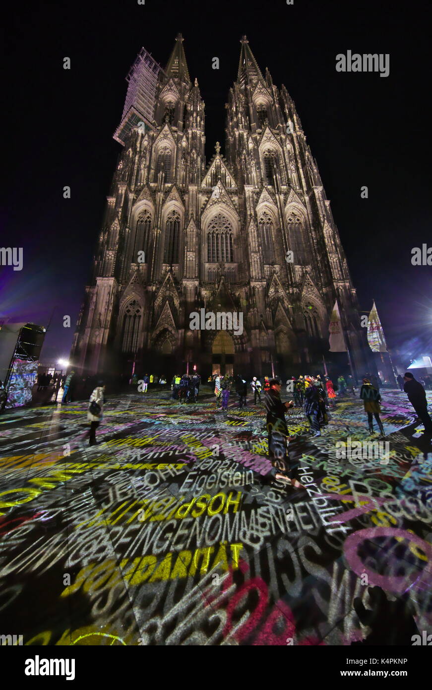 Light installation around the cologne cathedral, words and facades Stock Photo