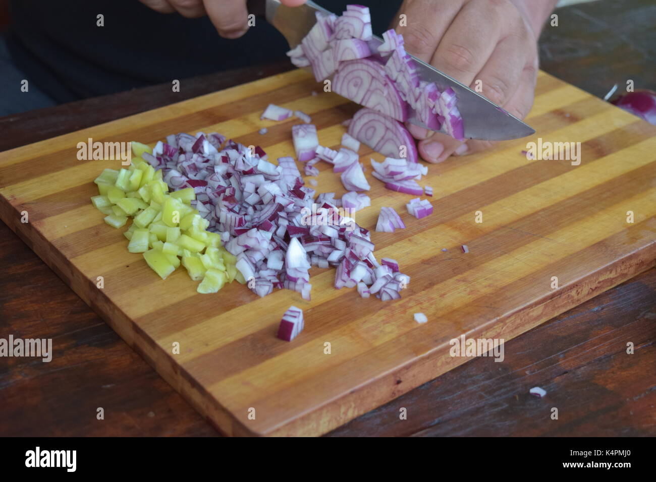 Hands knife cut onions hi-res stock photography and images - Alamy