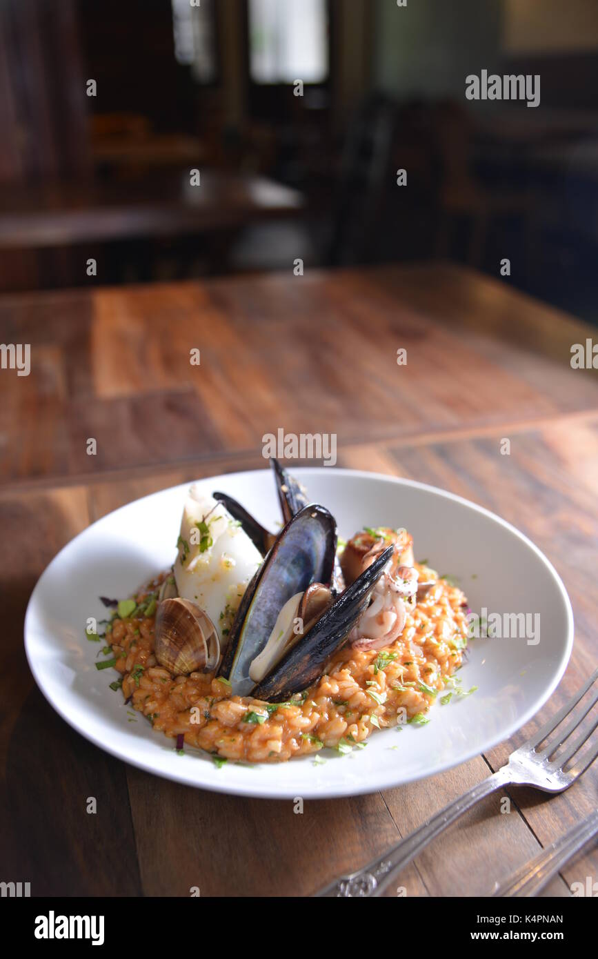 peacock clam tomato stew rice Stock Photo Alamy
