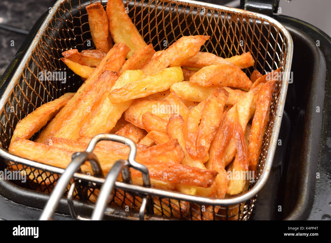Chip deep frying in hot boiling oil Stock Photo Alamy