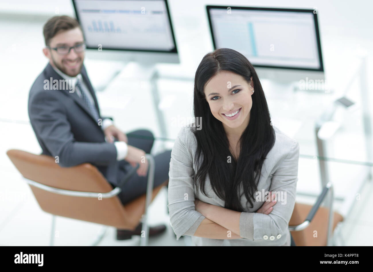 Portrait of a young business woman on a workplace background Stock ...