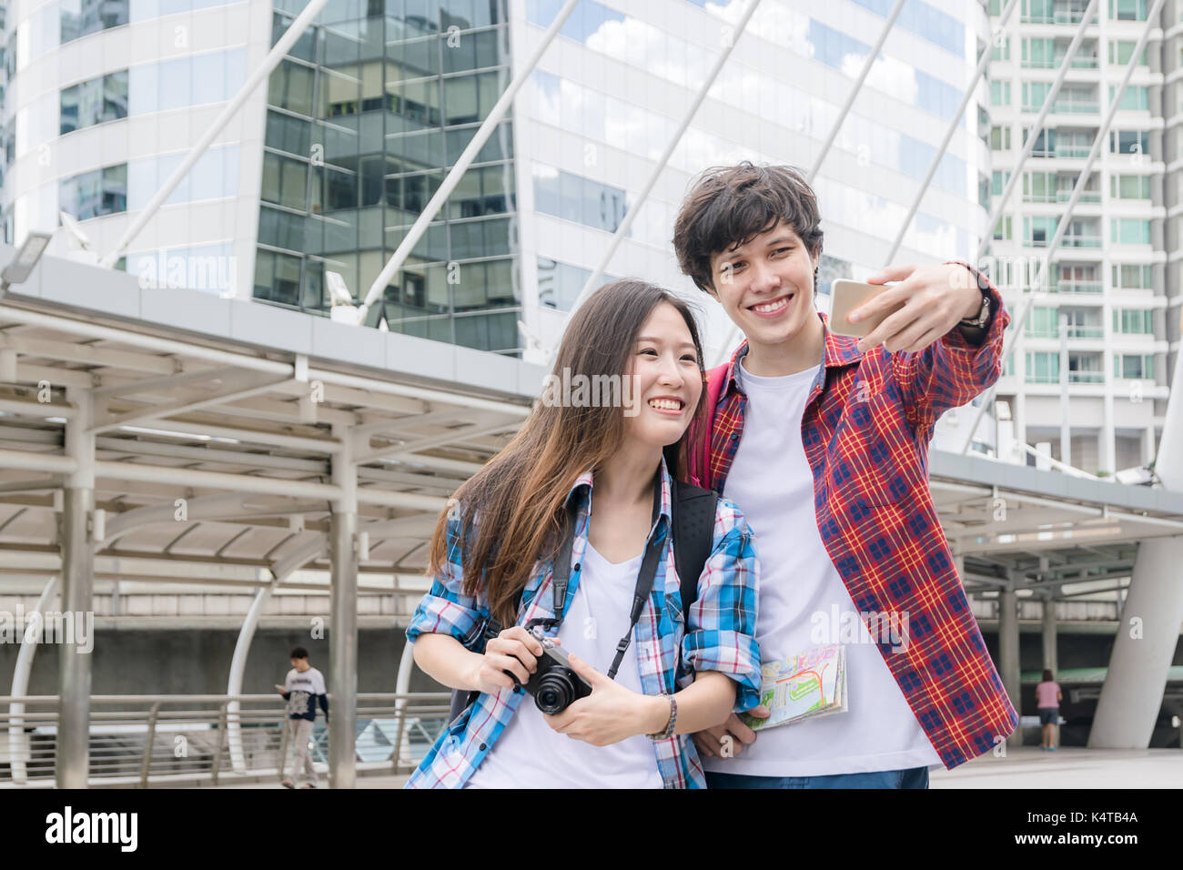Vacation And Friendship Concept Selfie Smiling Asian Girl And Foreign Boy Friends With City Guide Map And Backpack In City Stock Photo Alamy Vacation And Friendship Concept Selfie Smiling Asian Girl And Foreign Boy Friends With City Guide Map And Backpack In City Stock Photo Alamy