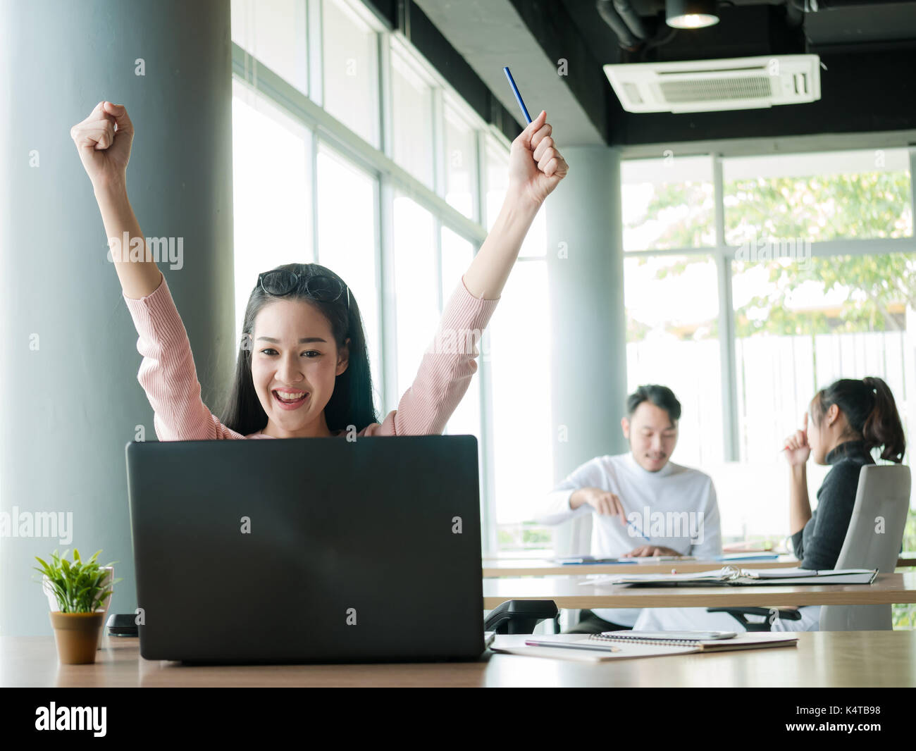 Businessman cheering desk in office hi-res stock photography and images ...