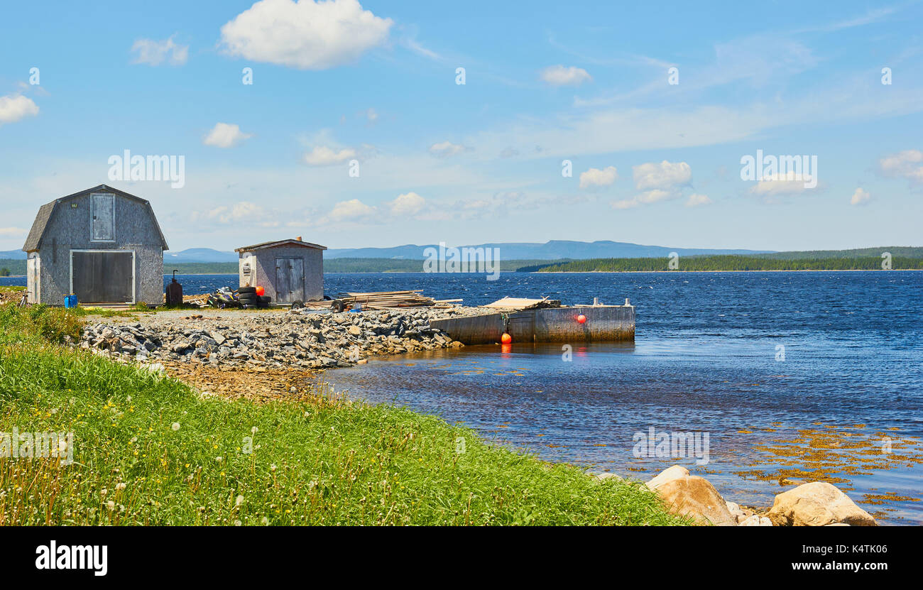 Rustic timber cabins and small jetty, Great Northern Peninsula
