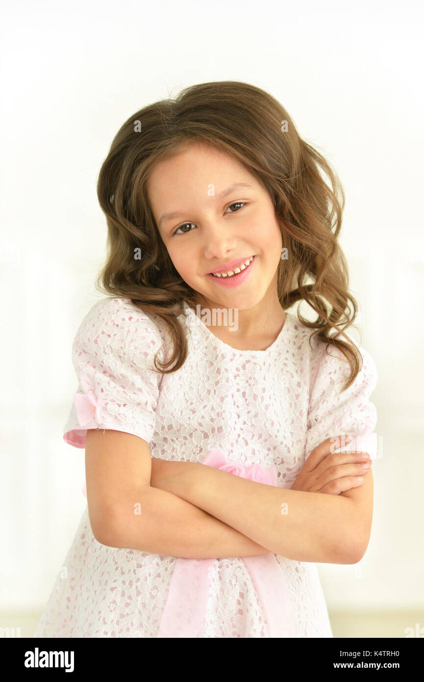 Portrait of beautiful little girl in white dress Stock Photo - Alamy