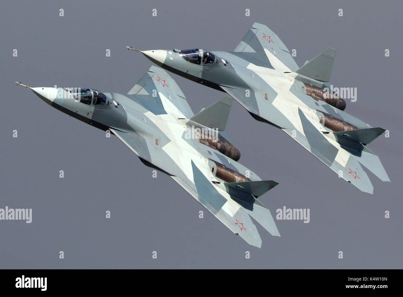 Zhukovsky, Moscow Region, Russia - August 24, 2013: Pair of Sukhoi T-50 PAK-FA 052 BLUE and 051 BLUE modern russian jet fighters performing demonstrat Stock Photo